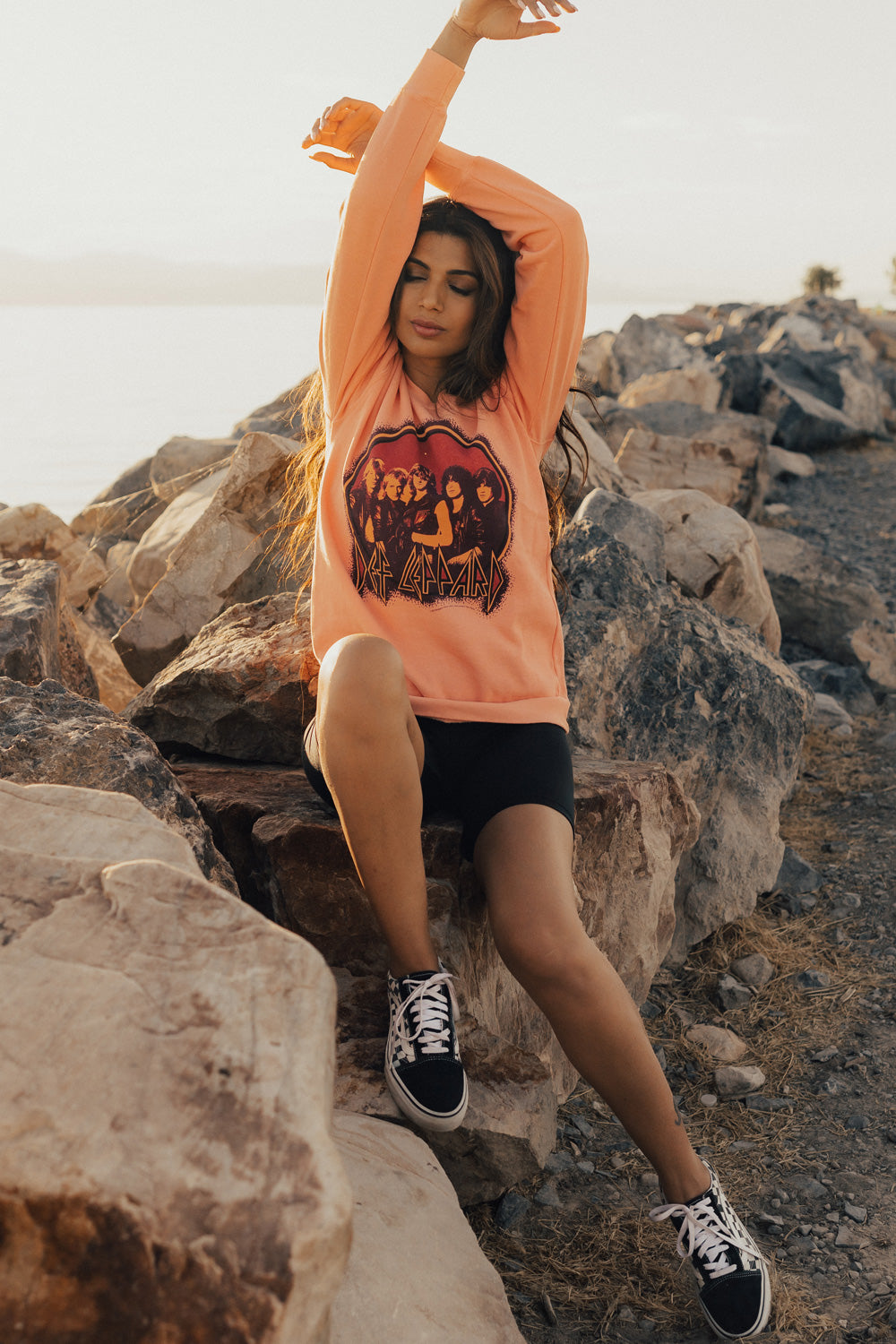 Upcycle Def Leppard School Sweater in peach color, featuring the iconic band logo, made from 100% cotton with eco-friendly dye.