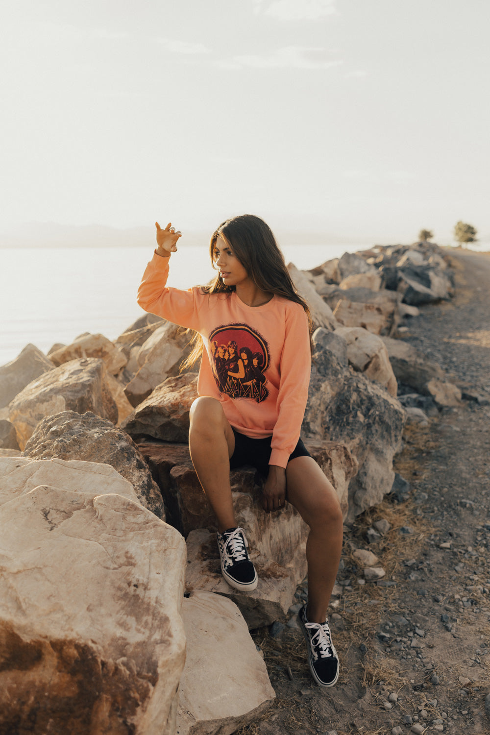 Upcycle Def Leppard School Sweater in peach color, featuring the iconic band logo, made from 100% cotton with eco-friendly dye.