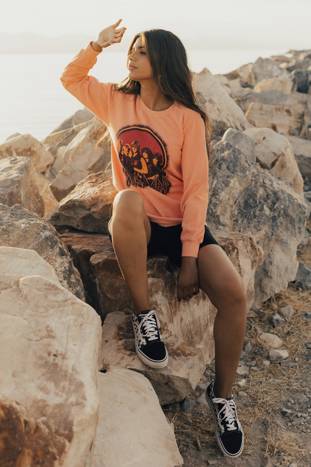 Upcycle Def Leppard School Sweater in peach color, featuring the iconic band logo, made from 100% cotton with eco-friendly dye.