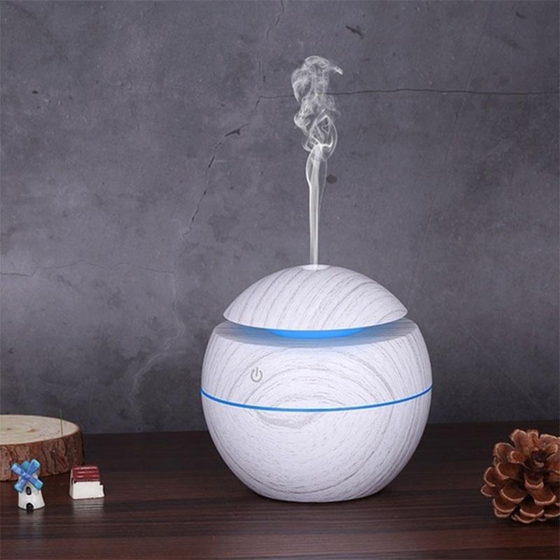 USB Aroma Air Humidifier with wood grain finish and LED lights, designed for home use to enhance air quality and ambiance.