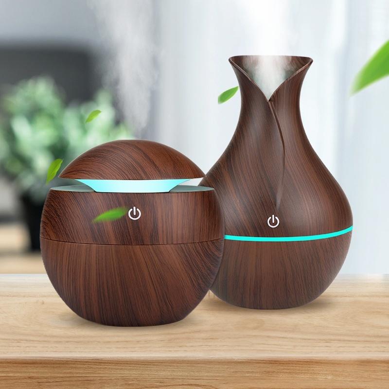 USB Aroma Air Humidifier with wood grain finish and LED lights, designed for home use to enhance air quality and ambiance.