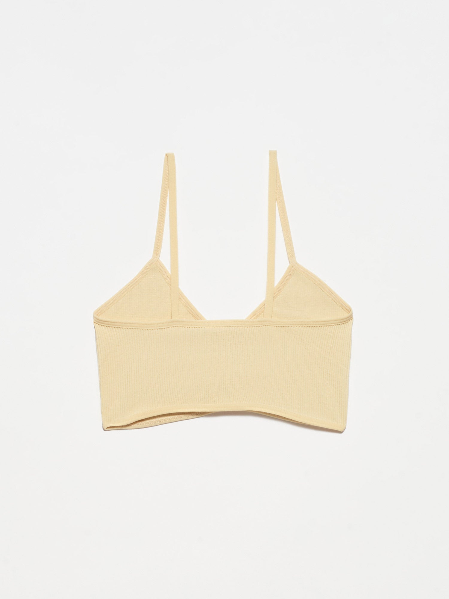 A stylish V Neck Strappy Bra made from soft polyamide and elastane, featuring adjustable straps and a trendy design.