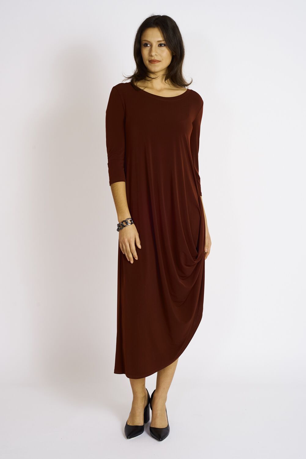 A stylish woman wearing the elegant Versailles Dress, showcasing its flattering fit and versatile design.