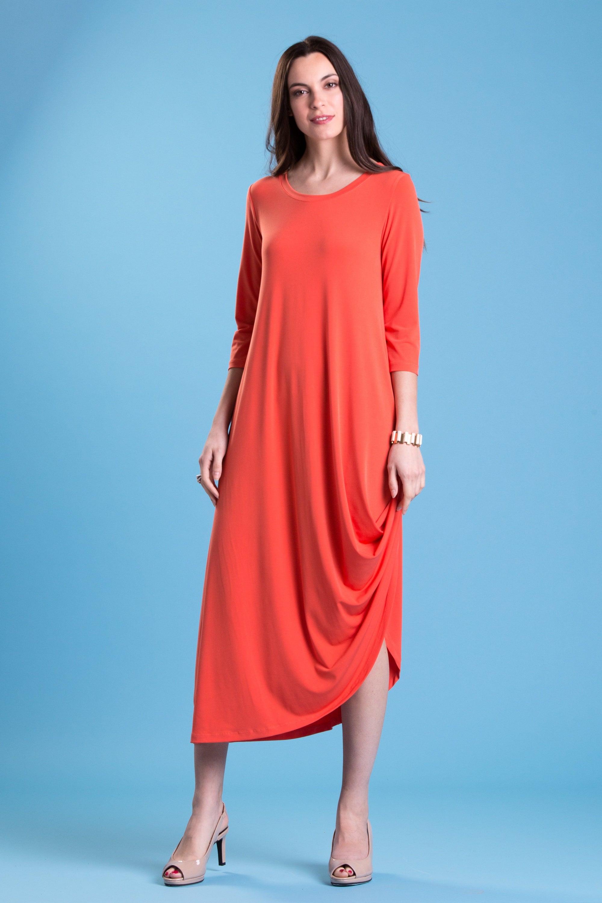 A stylish woman wearing the elegant Versailles Dress, showcasing its flattering fit and versatile design.