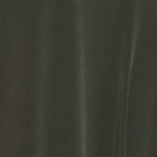 A stylish woman wearing the elegant Versailles Dress, showcasing its flattering fit and versatile design.