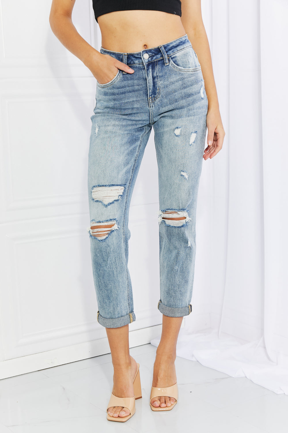 VERVET Let You Go Full Size Distressed Jeans featuring a cropped design with pockets and a stylish distressed finish.