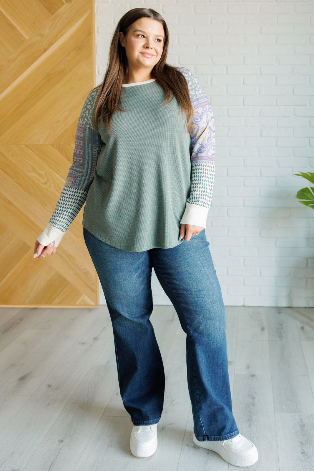 A stylish Very Curious Mixed Print Top featuring a waffle knit bodice and floral raglan sleeves, perfect for casual wear.