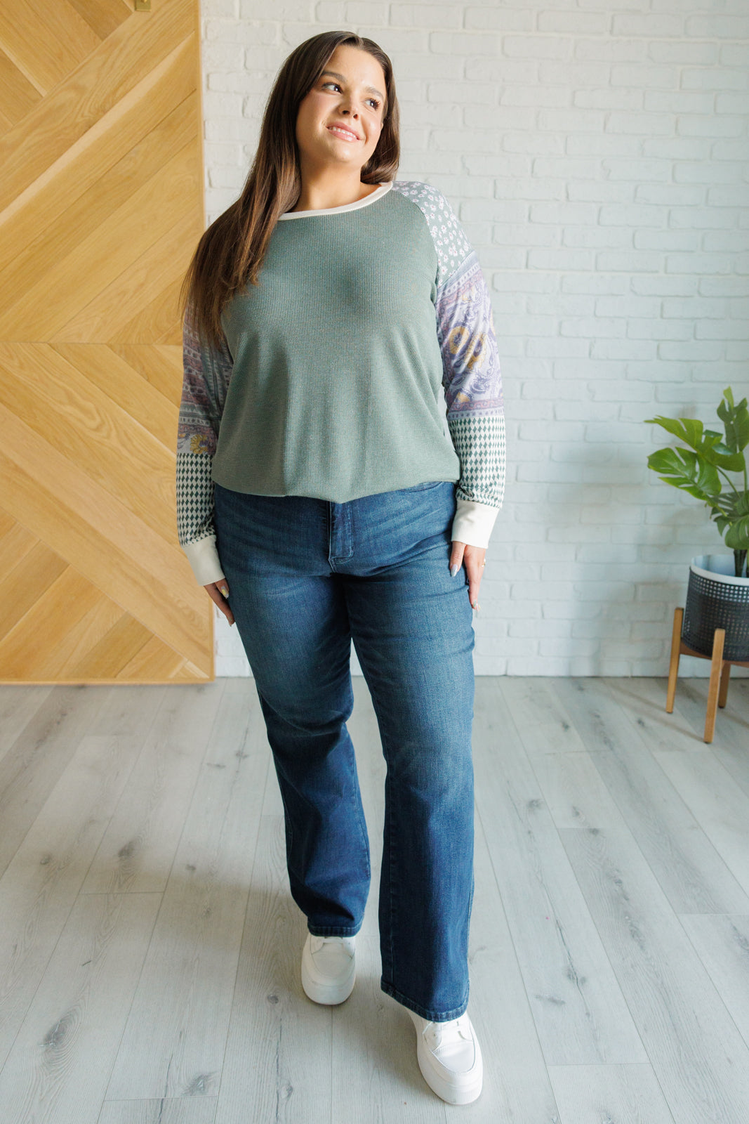 A stylish Very Curious Mixed Print Top featuring a waffle knit bodice and floral raglan sleeves, perfect for casual wear.