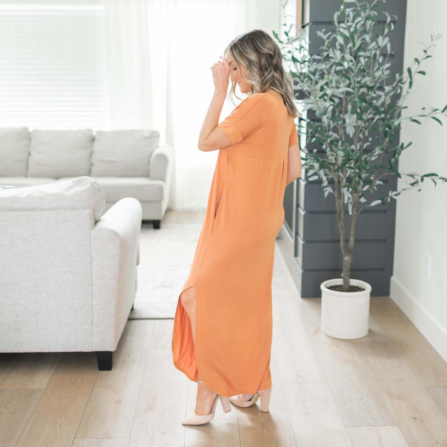 A stylish Viscose Side Slit V-neck Short Sleeve Maxi Dress in vibrant colors, featuring a V-neck collar and knee-high side slits.