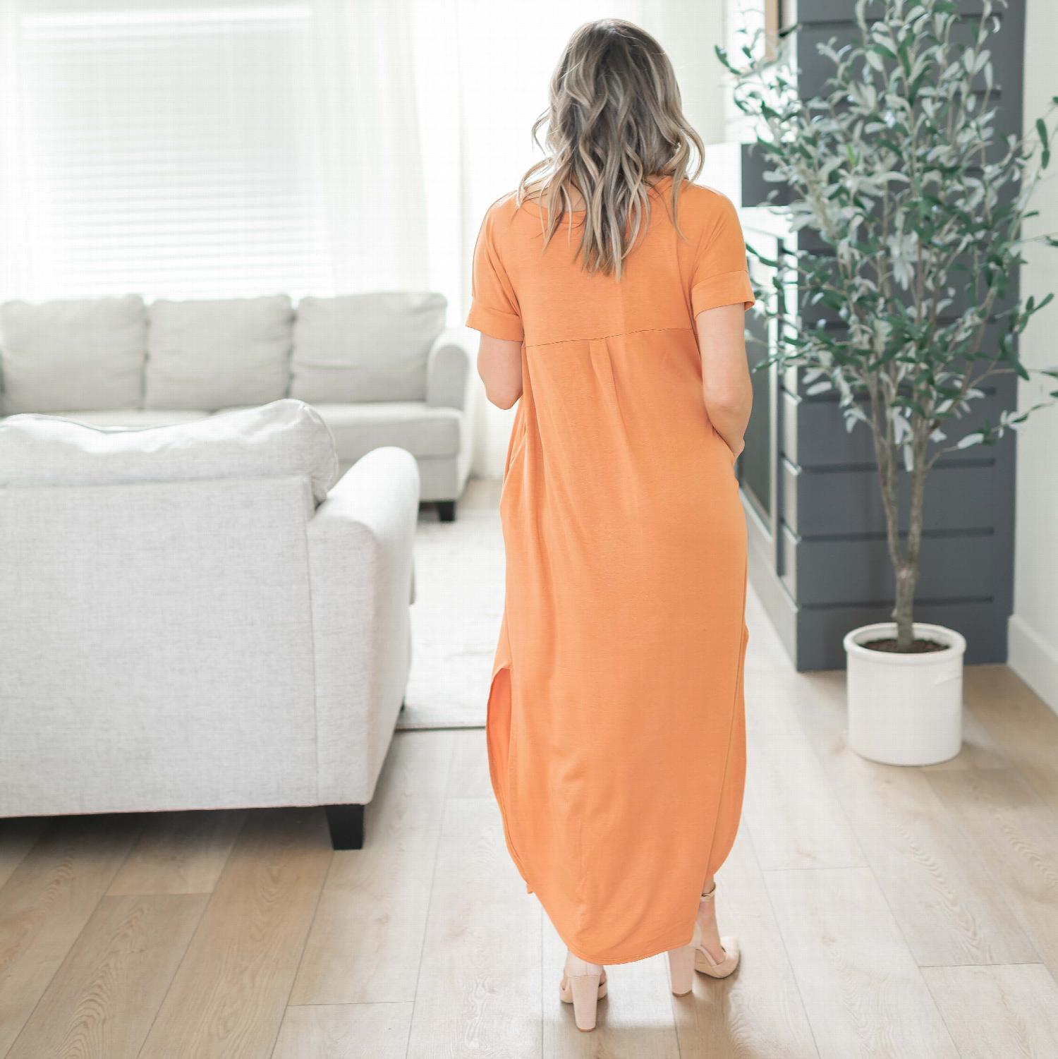 A stylish Viscose Side Slit V-neck Short Sleeve Maxi Dress in vibrant colors, featuring a V-neck collar and knee-high side slits.