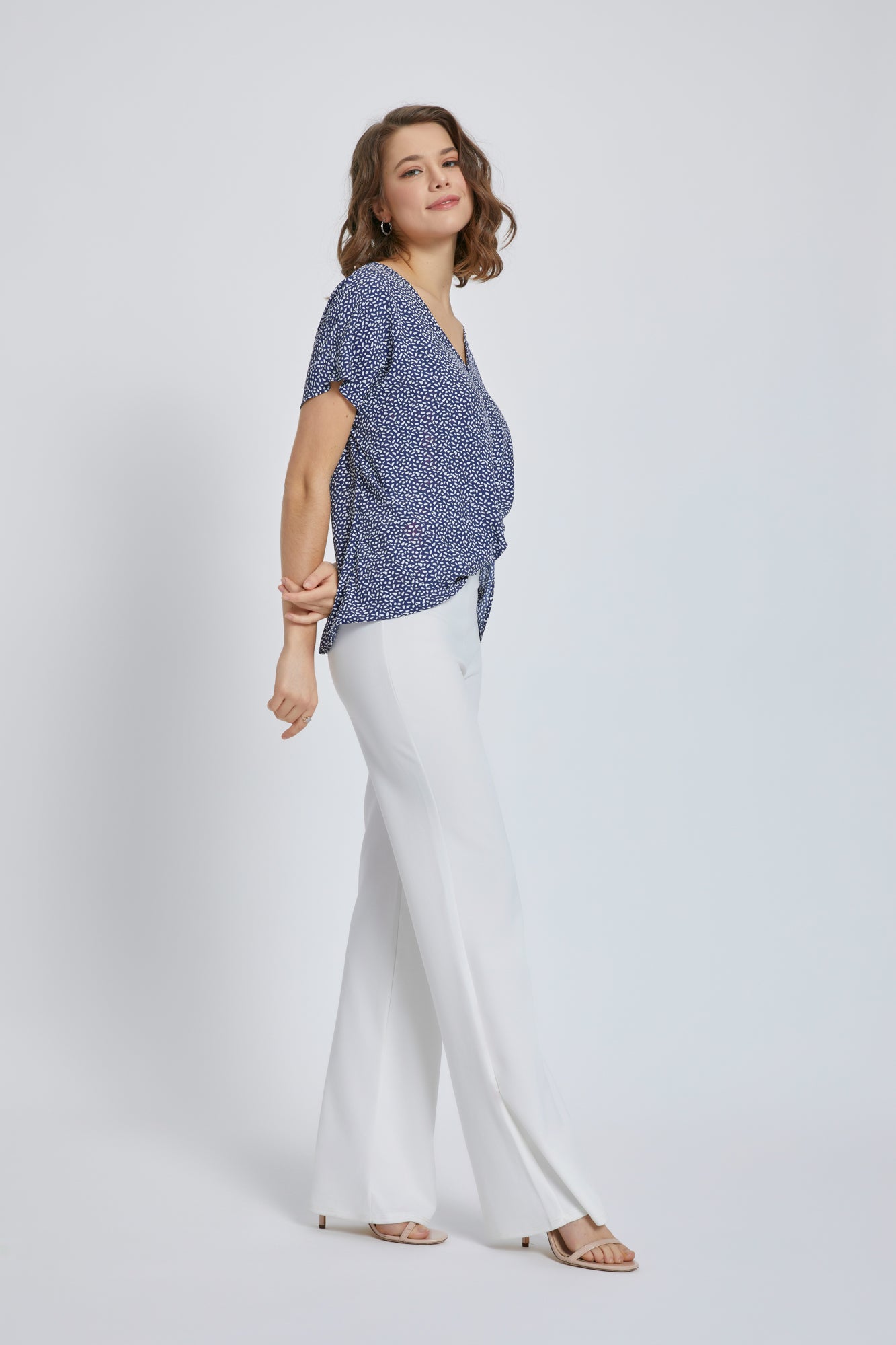 A stylish V-Neck Short Sleeve Wrap Front Top for Women featuring a knot detail at the waist, perfect for casual or dressy occasions.
