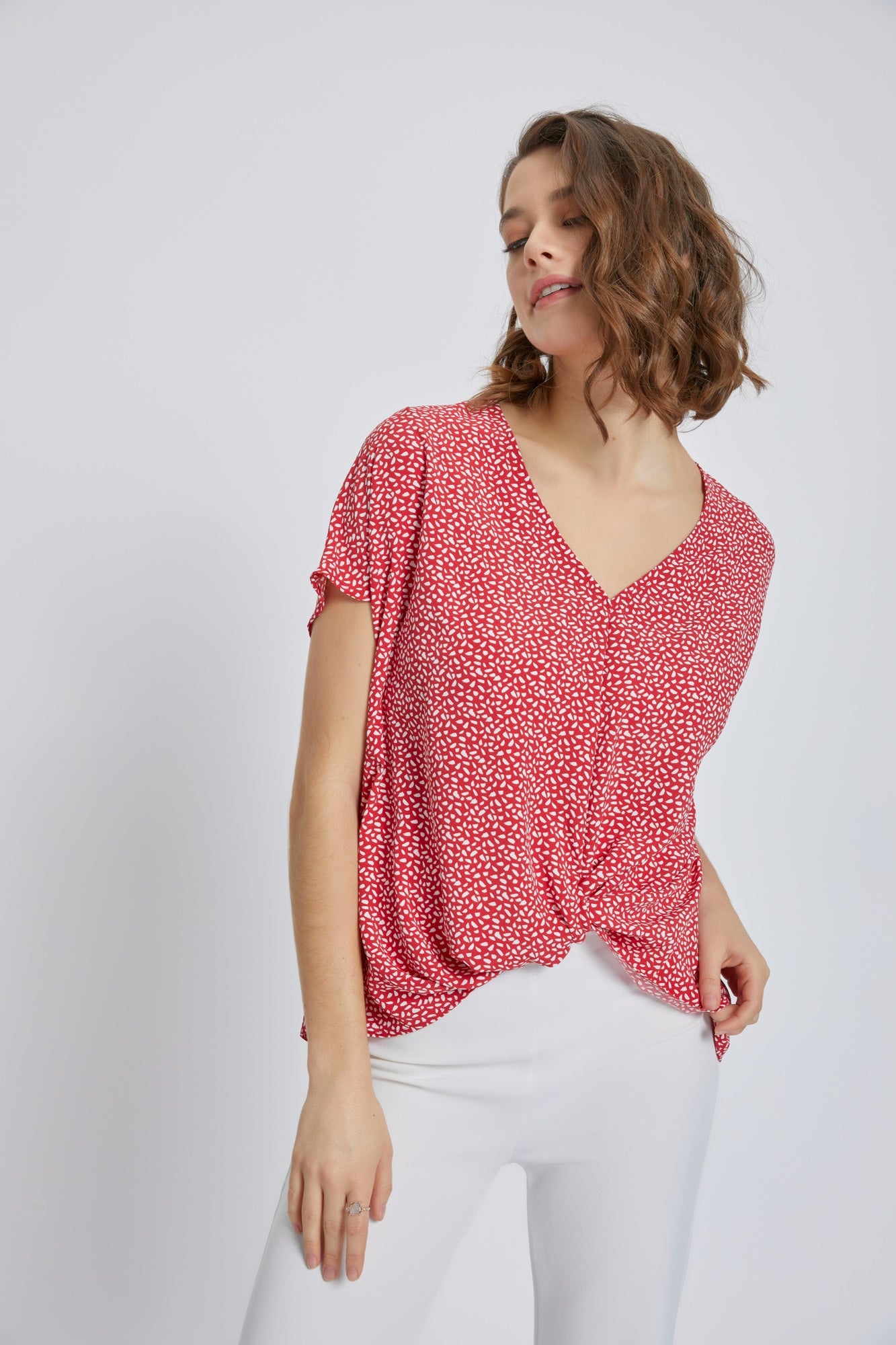 A stylish V-Neck Short Sleeve Wrap Front Top for Women featuring a knot detail at the waist, perfect for casual or dressy occasions.