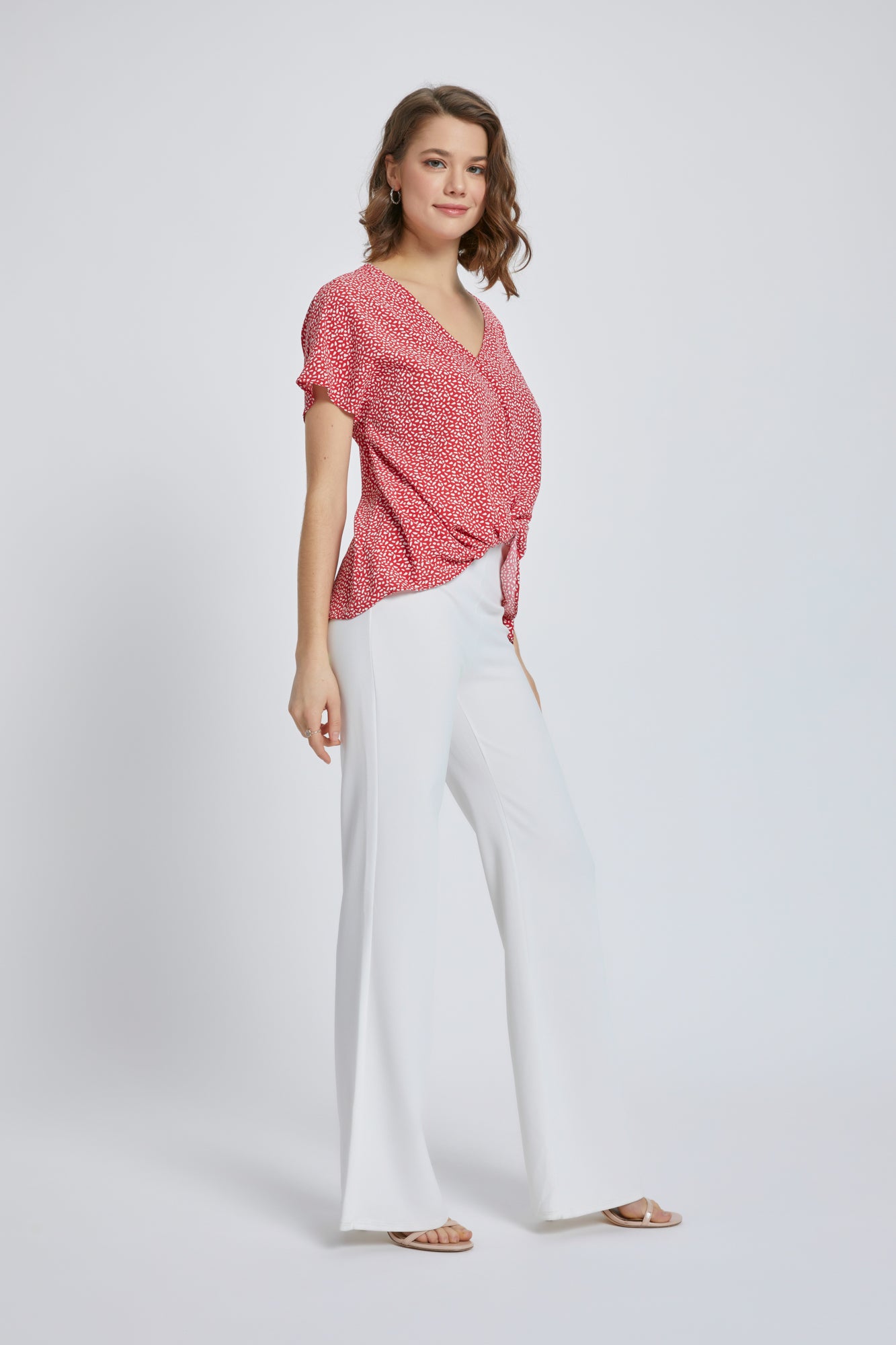 A stylish V-Neck Short Sleeve Wrap Front Top for Women featuring a knot detail at the waist, perfect for casual or dressy occasions.