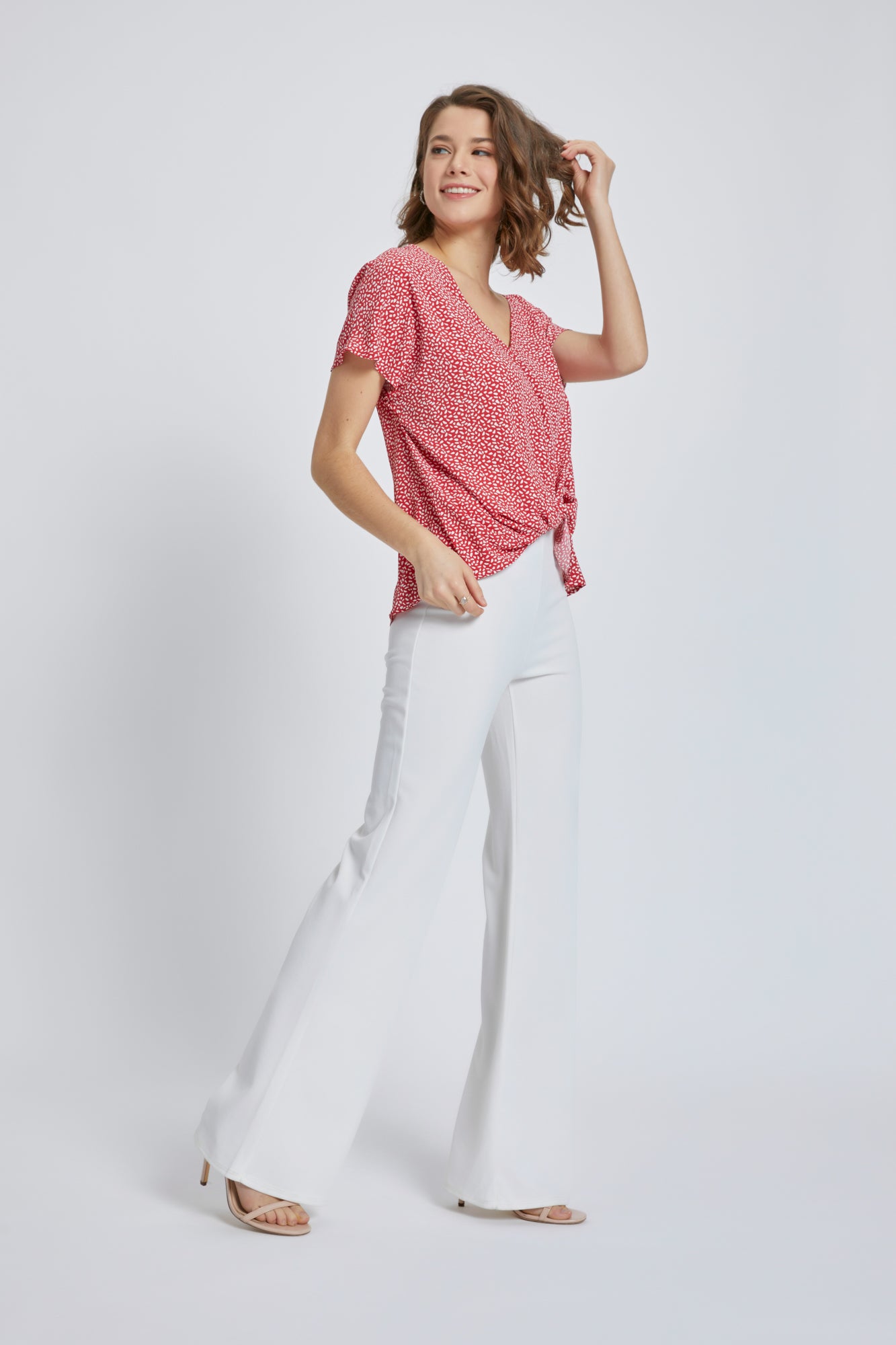 A stylish V-Neck Short Sleeve Wrap Front Top for Women featuring a knot detail at the waist, perfect for casual or dressy occasions.
