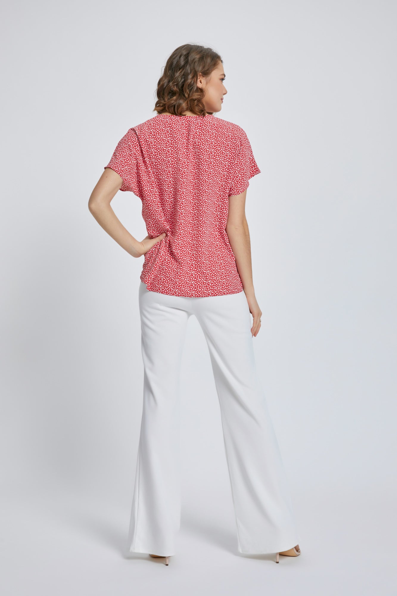 A stylish V-Neck Short Sleeve Wrap Front Top for Women featuring a knot detail at the waist, perfect for casual or dressy occasions.