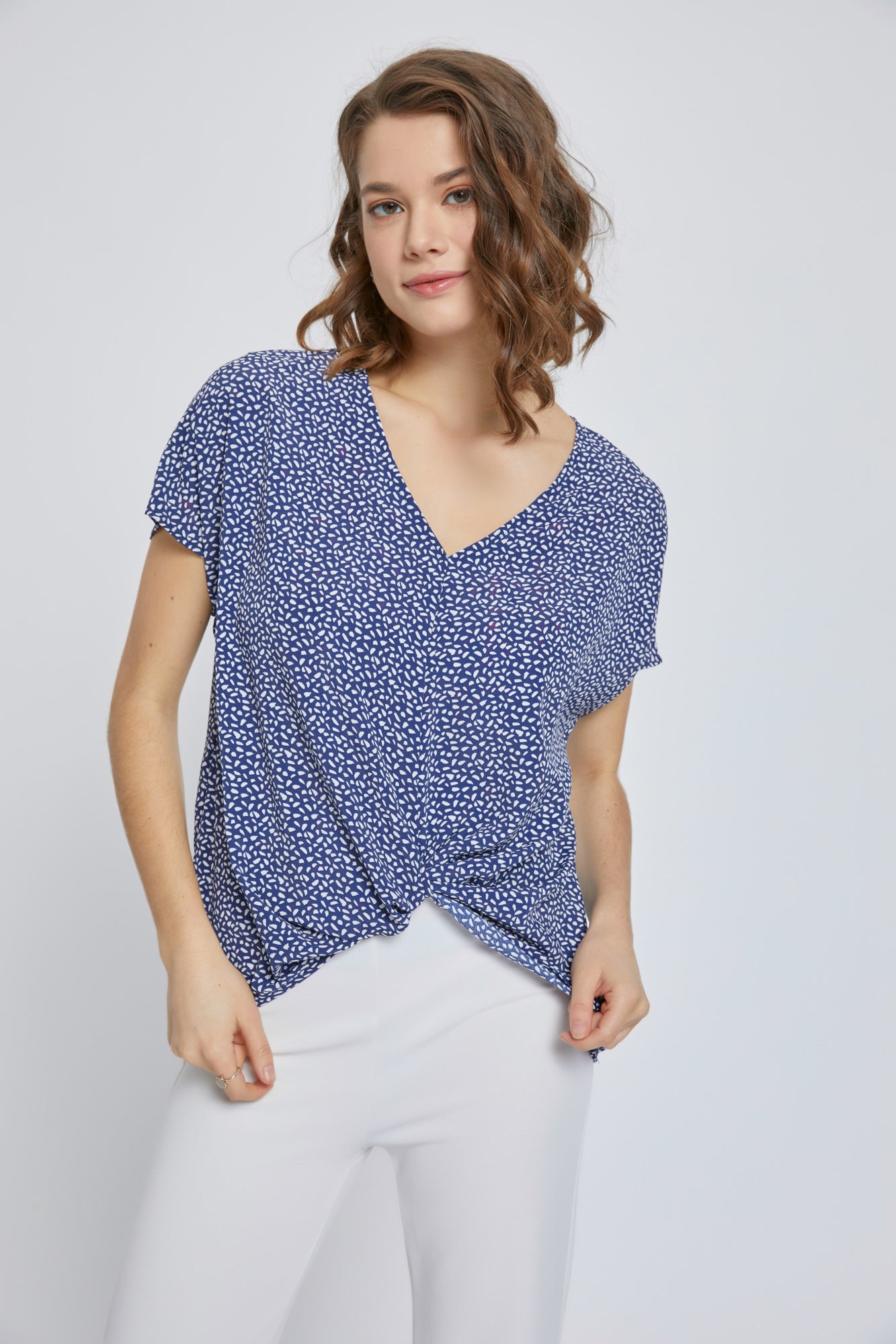 A stylish V-Neck Short Sleeve Wrap Front Top for Women featuring a knot detail at the waist, perfect for casual or dressy occasions.