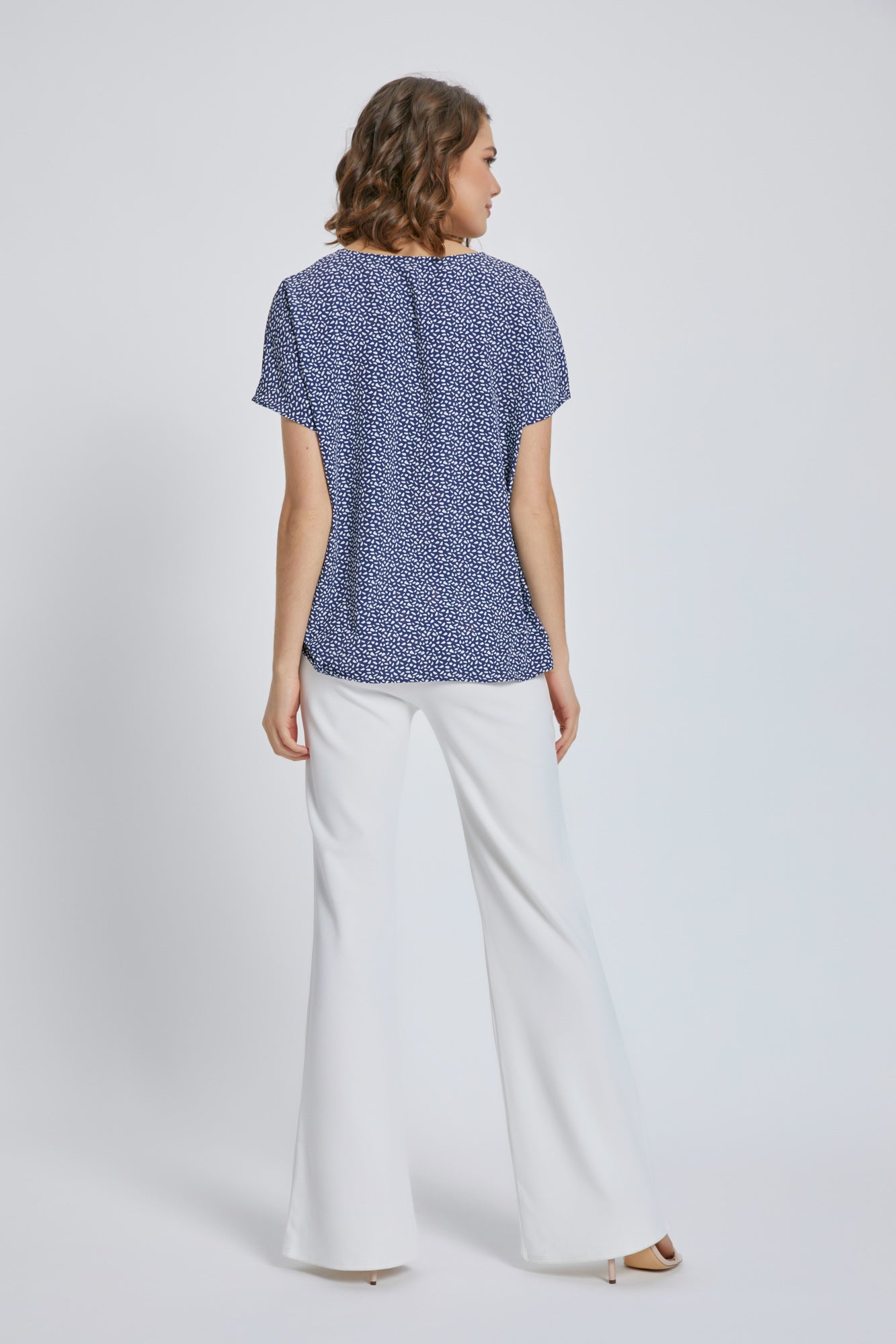 A stylish V-Neck Short Sleeve Wrap Front Top for Women featuring a knot detail at the waist, perfect for casual or dressy occasions.