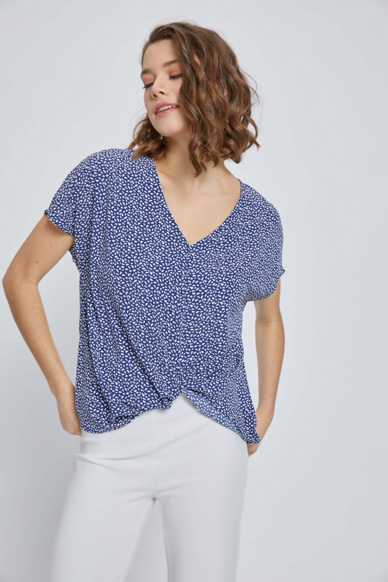 A stylish V-Neck Short Sleeve Wrap Front Top for Women featuring a knot detail at the waist, perfect for casual or dressy occasions.