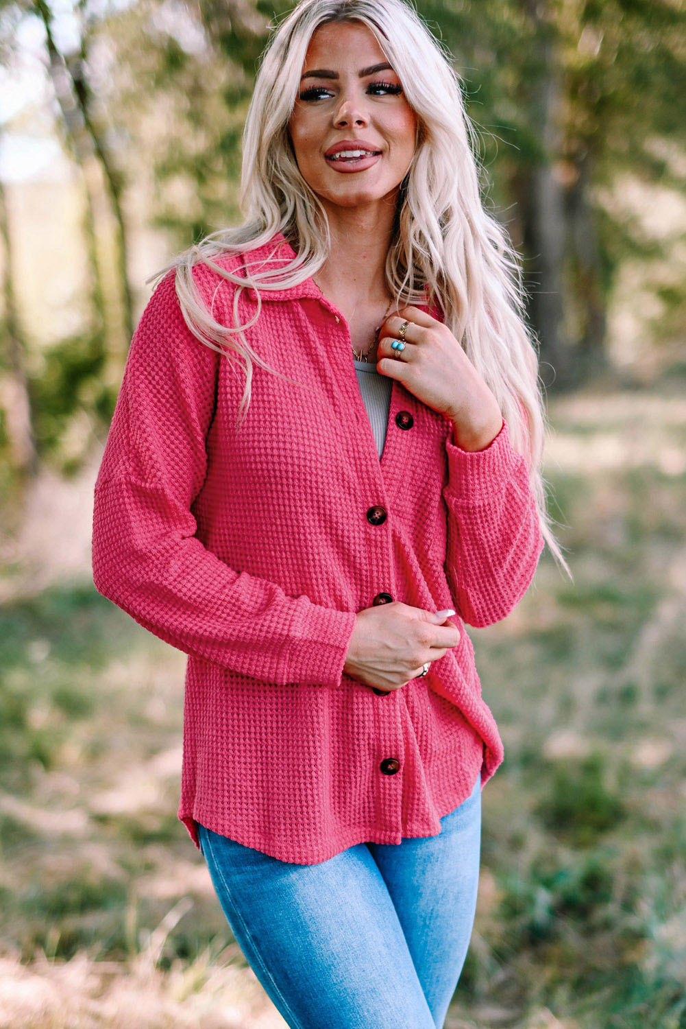 A stylish woman wearing a Waffle Knit Button Up Casual Shirt, showcasing its oversized fit and button-down design.
