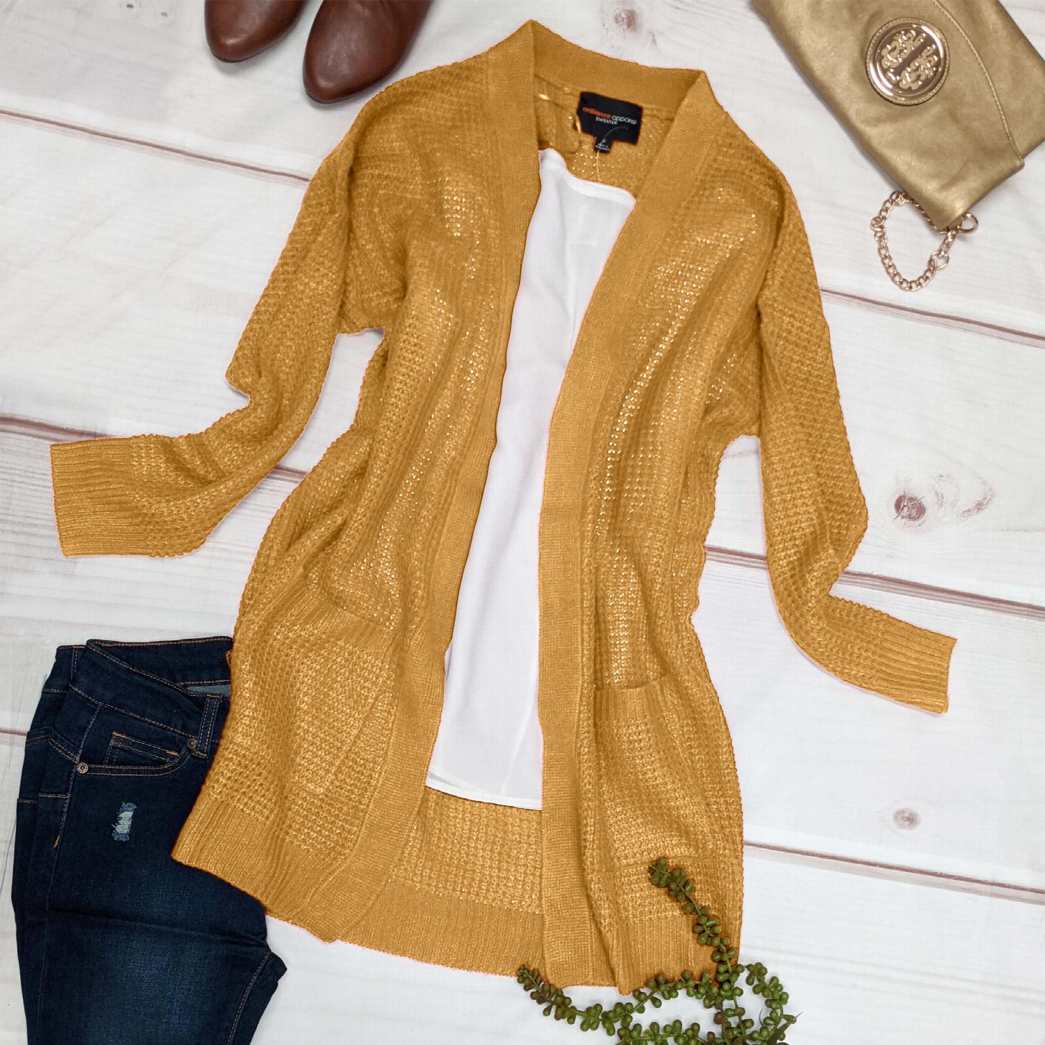 Waffle knit pocketed long sleeve cardigan sweater in a stylish open front design, featuring large pockets and a relaxed fit.