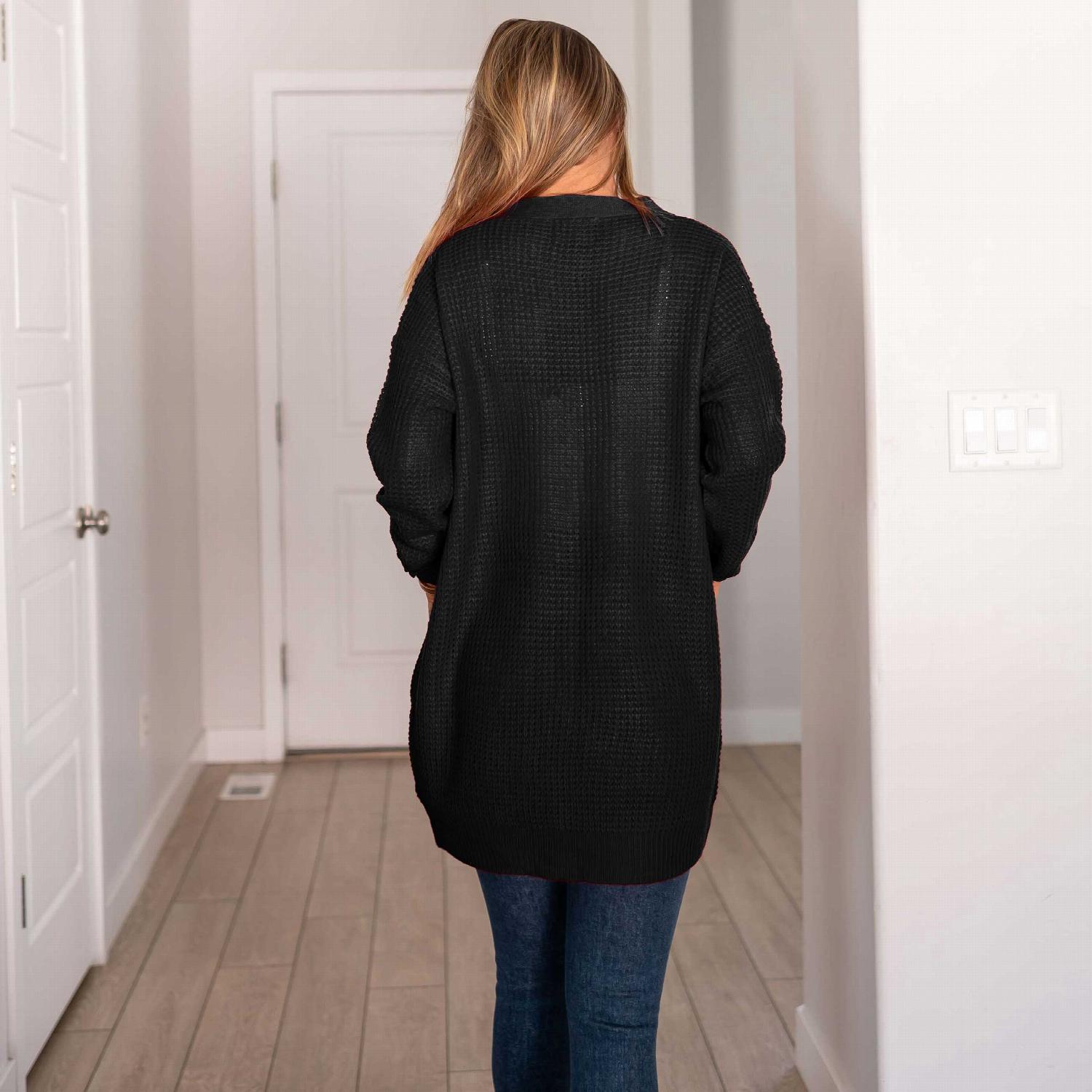 Waffle knit pocketed long sleeve cardigan sweater in a stylish open front design, featuring large pockets and a relaxed fit.