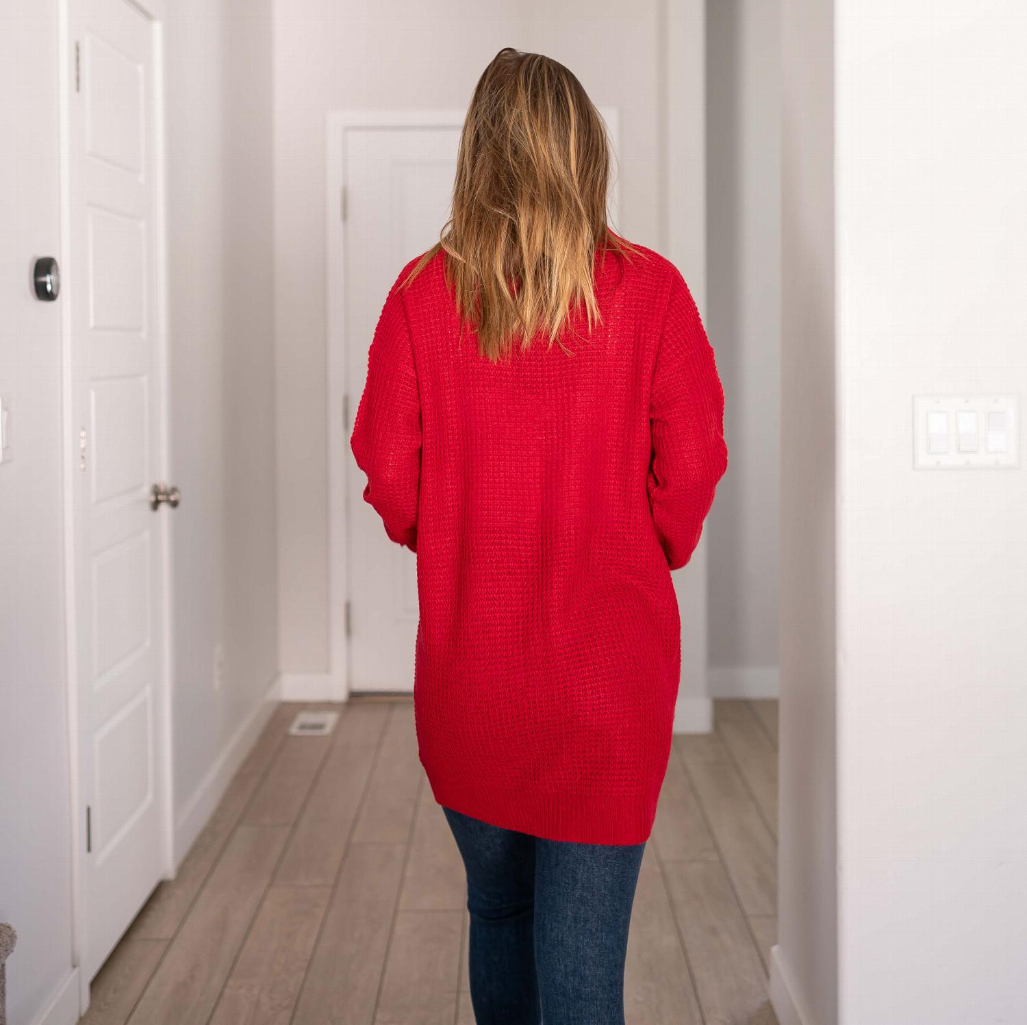 Waffle knit pocketed long sleeve cardigan sweater in a stylish open front design, featuring large pockets and a relaxed fit.