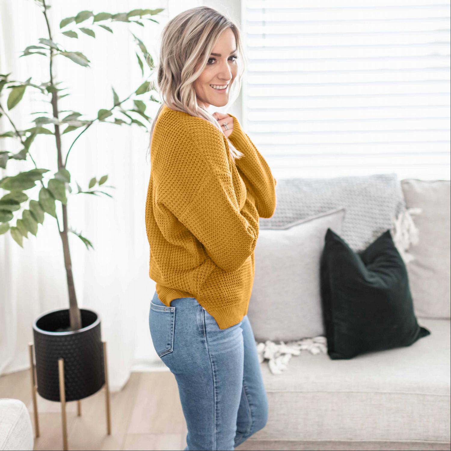 Waffle Knit Round Neck Long Sleeve Sweater featuring a side slit, ribbed cuffs, and a relaxed fit, perfect for fall fashion.