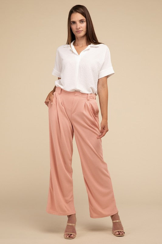 A pair of stylish waffle trouser pants in textured fabric, featuring an elastic waistband and pockets, perfect for both casual and formal wear.