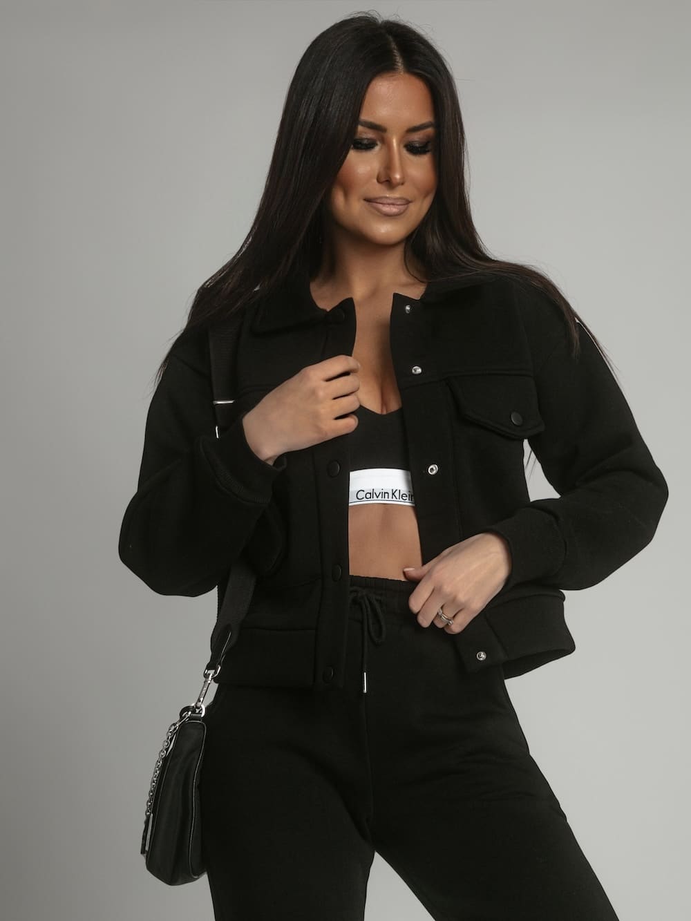 Warm women's katana sweatpants set in black, showcasing a sporty and stylish design suitable for colder weather.