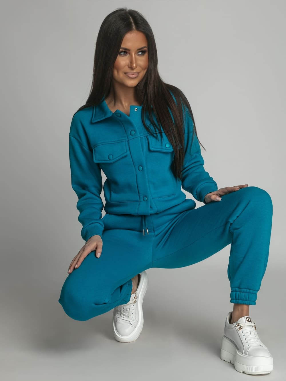 Warm women's set katana sweatpants in turquoise, featuring a sporty design suitable for colder weather.