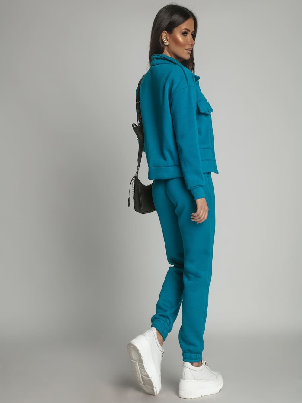 Warm women's set katana sweatpants in turquoise, featuring a sporty design suitable for colder weather.