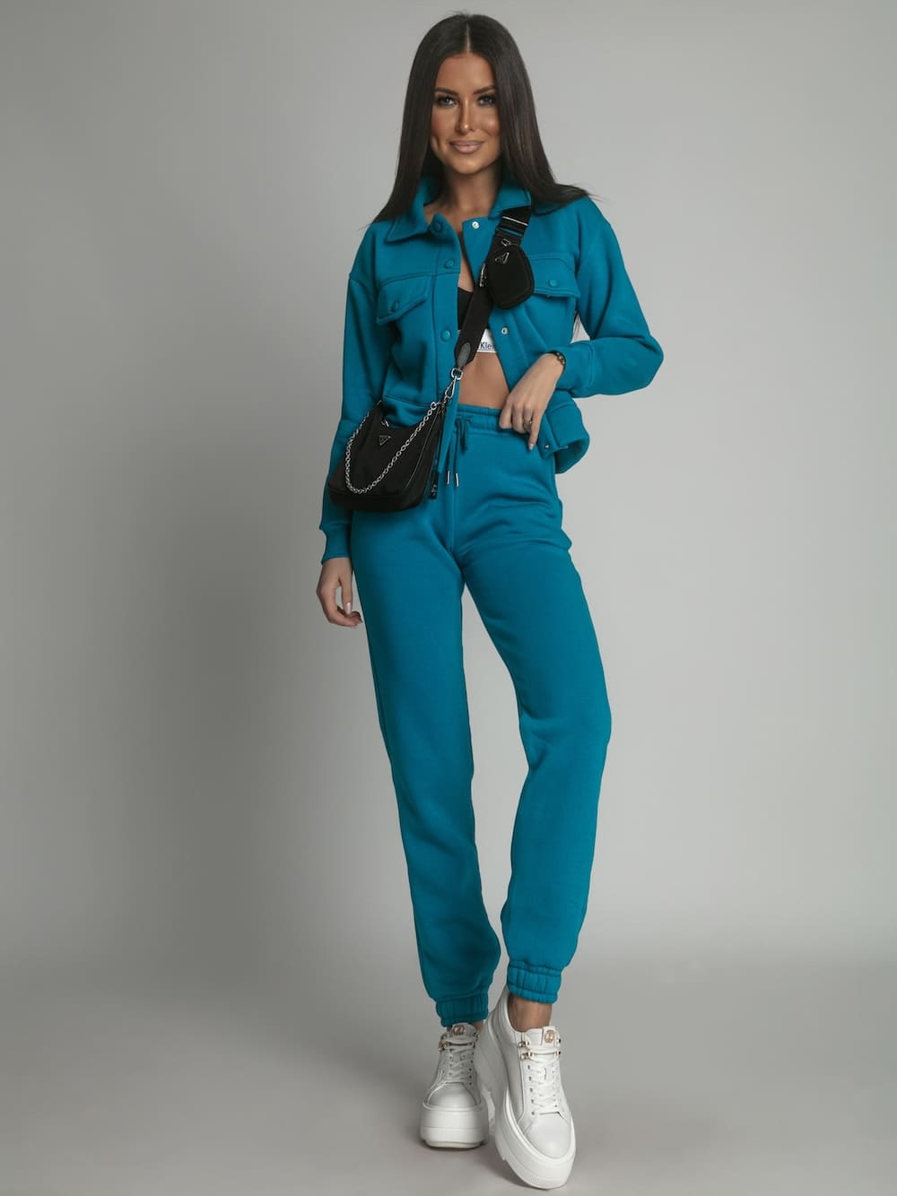Warm women's set katana sweatpants in turquoise, featuring a sporty design suitable for colder weather.