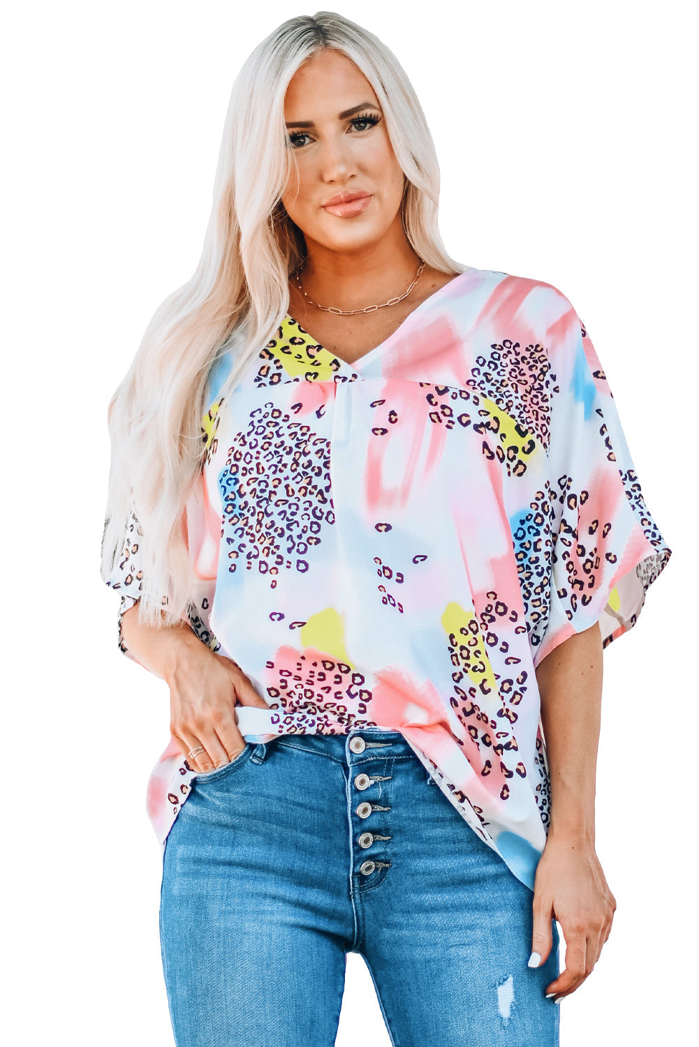 A vibrant Watercolor Print Loose Top featuring an oversized fit, v-neck design, and colorful animal print details, perfect for summer wear.