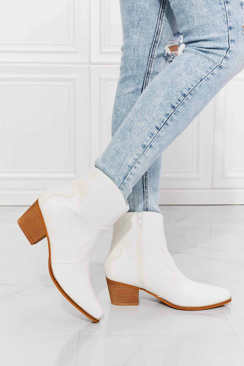 Watertower Town Faux Leather Western Ankle Boots in White with a pointed toe and stacked heel, showcasing a stylish design.