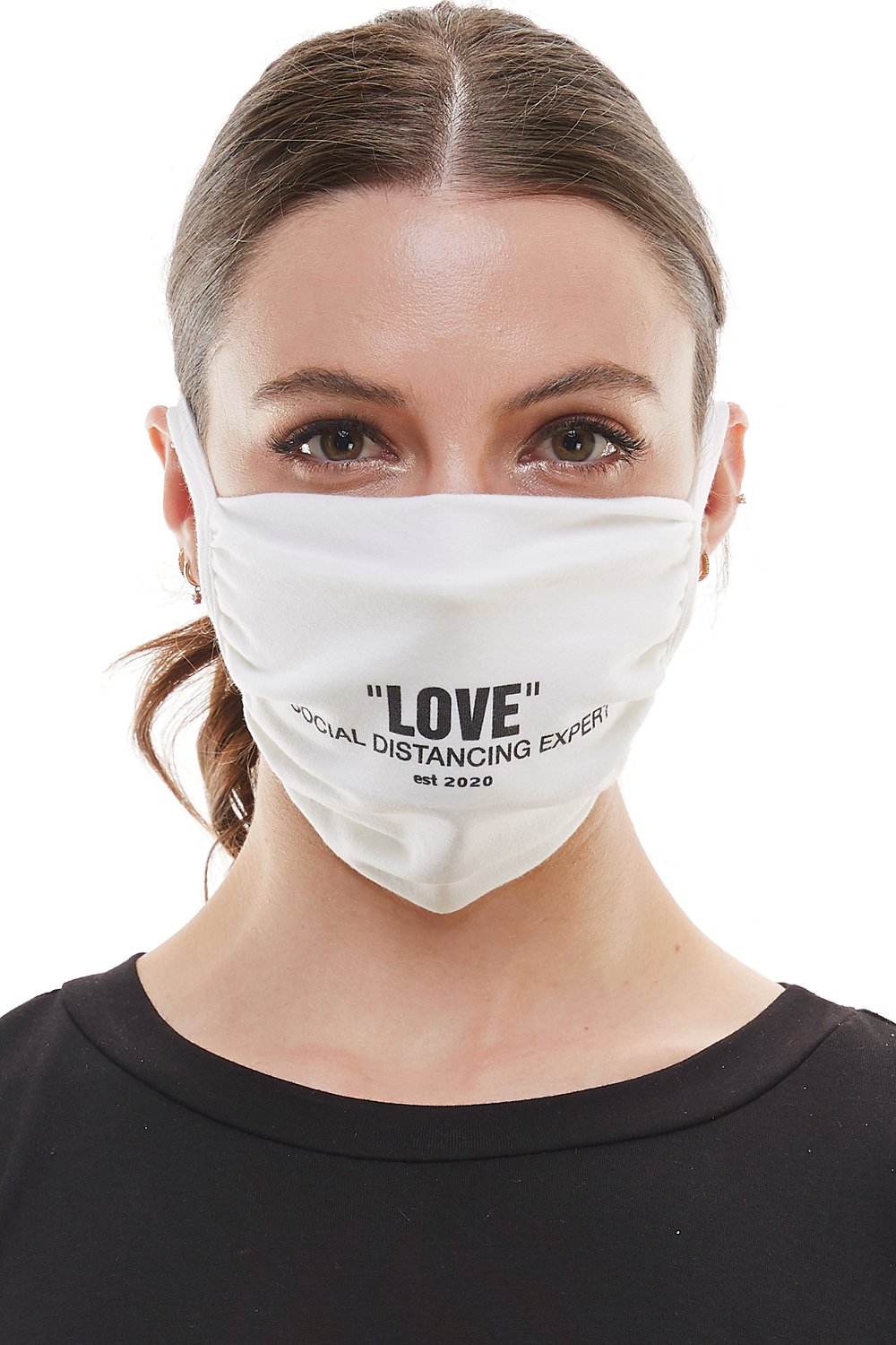 White adjustable tie face mask made of washable cotton fabric, featuring four tie-up straps and an inner pocket for filters.