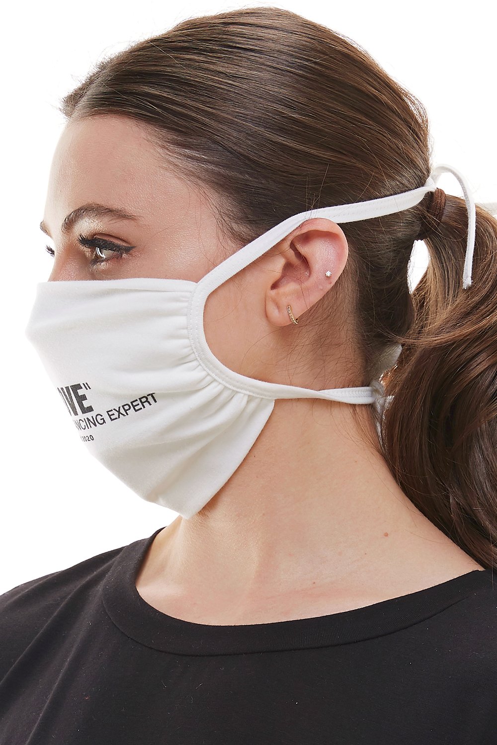 White adjustable tie face mask made of washable cotton fabric, featuring four tie-up straps and an inner pocket for filters.