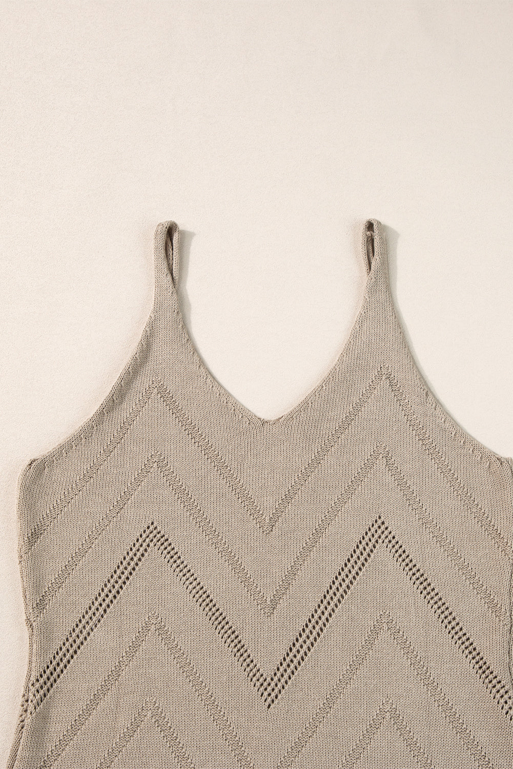 White Chevron Pointelle Knit Spaghetti Straps Sweater Vest showcasing intricate pattern and V-neck design.