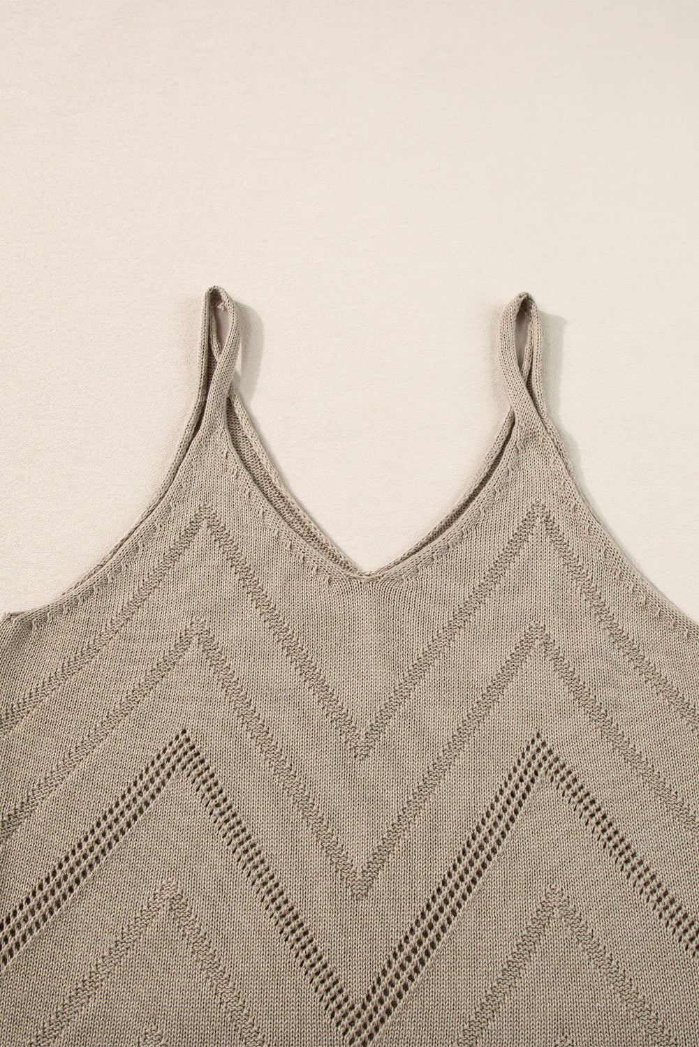 White Chevron Pointelle Knit Spaghetti Straps Sweater Vest showcasing intricate pattern and V-neck design.