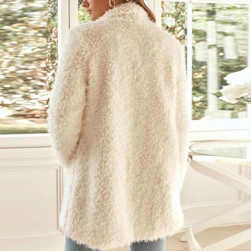 A stylish white faux fur jacket with a turn-down collar and long sleeves, perfect for women seeking warmth and fashion.