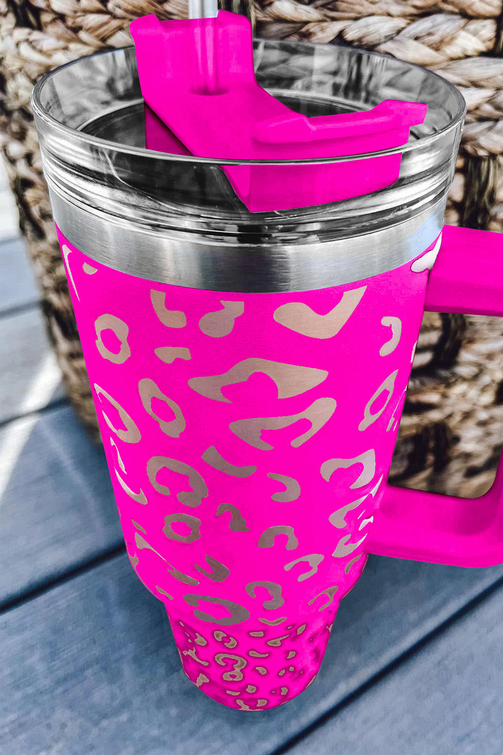 Three leopard spotted 40oz stainless steel double insulated cups, showcasing their stylish design and durable construction.