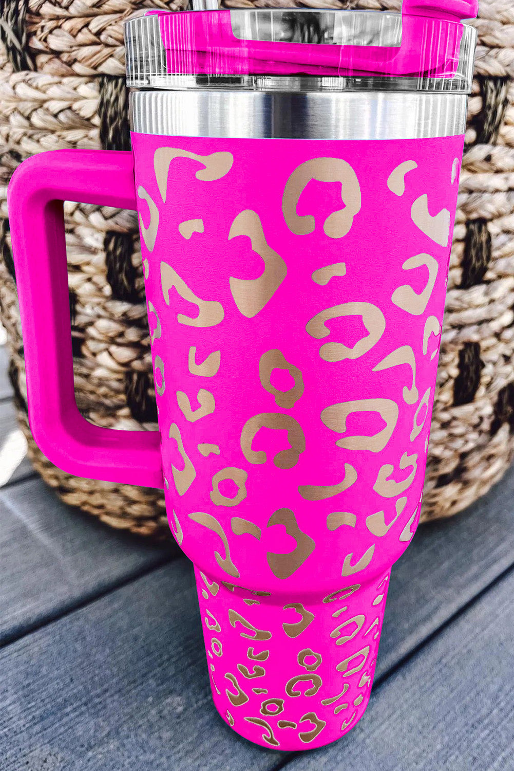 Three leopard spotted 40oz stainless steel double insulated cups, showcasing their stylish design and durable construction.
