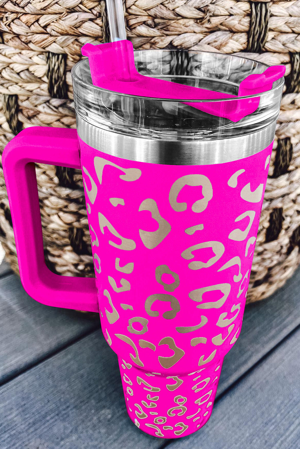 Three leopard spotted 40oz stainless steel double insulated cups, showcasing their stylish design and durable construction.