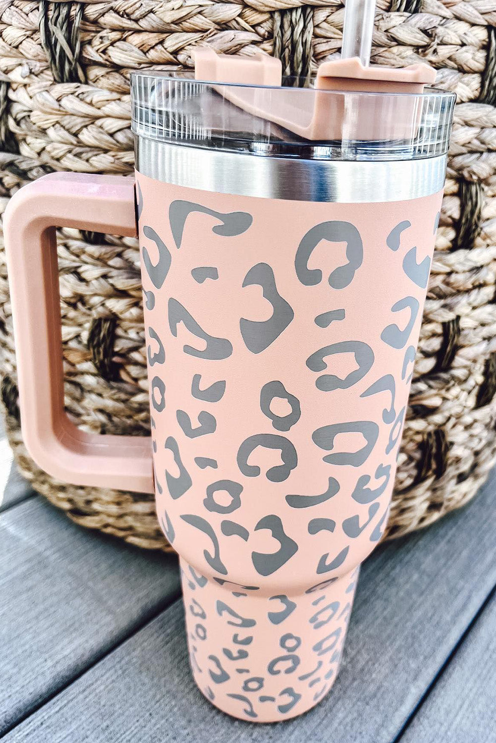 Three leopard spotted 40oz stainless steel double insulated cups, showcasing their stylish design and durable construction.
