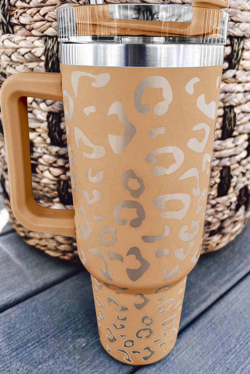 Three leopard spotted 40oz stainless steel double insulated cups, showcasing their stylish design and durable construction.