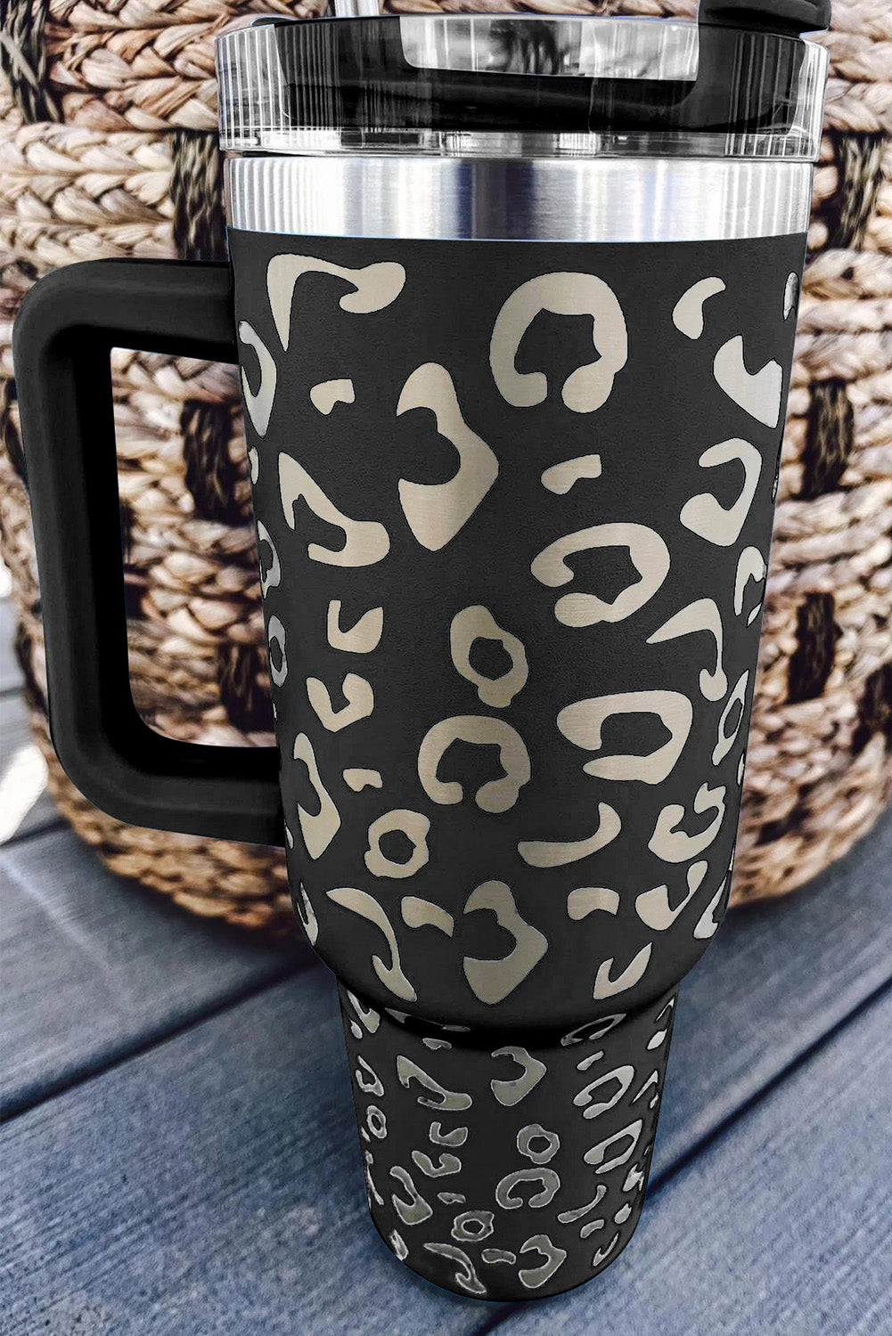 Three leopard spotted 40oz stainless steel double insulated cups, showcasing their stylish design and durable construction.