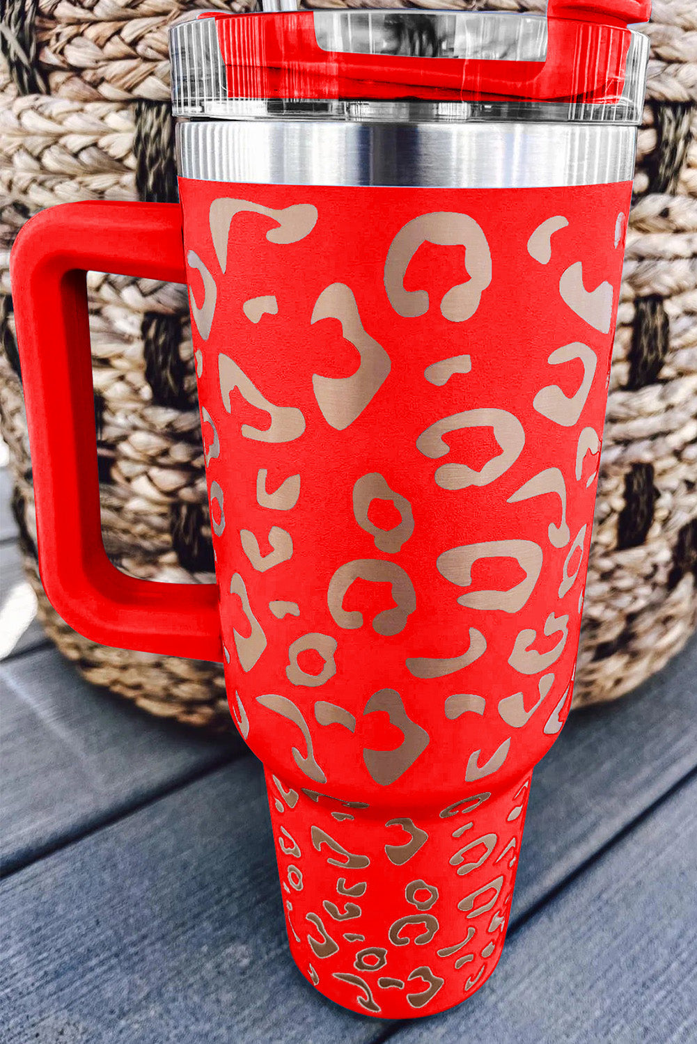 Three leopard spotted 40oz stainless steel double insulated cups, showcasing their stylish design and durable construction.
