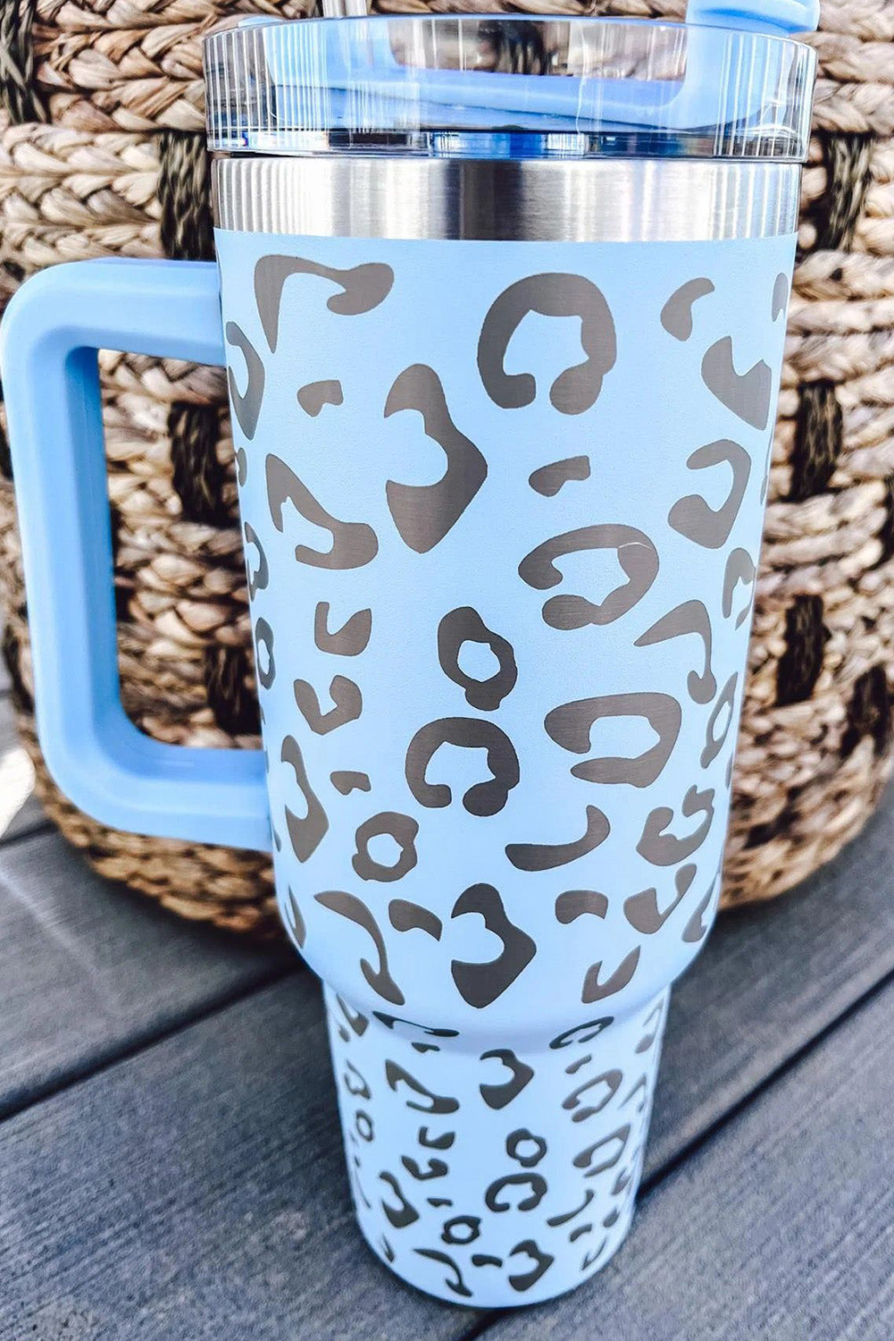 Three leopard spotted 40oz stainless steel double insulated cups, showcasing their stylish design and durable construction.