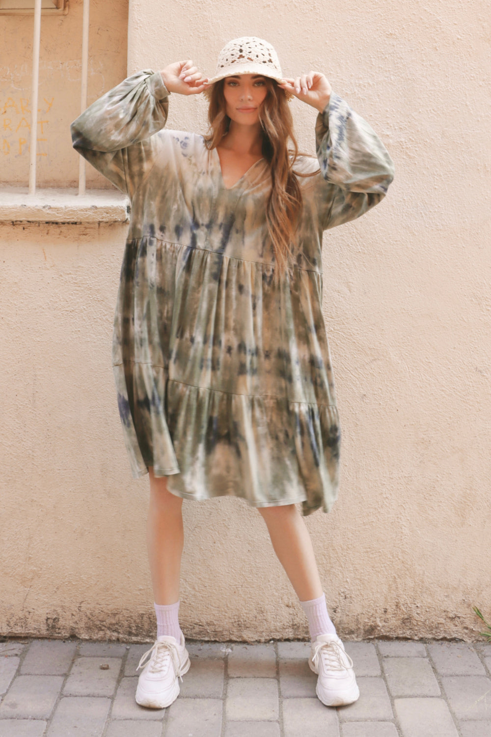 A stylish olive tie-dye dress made from soft organic cotton and tencel, perfect for casual outings and special occasions.