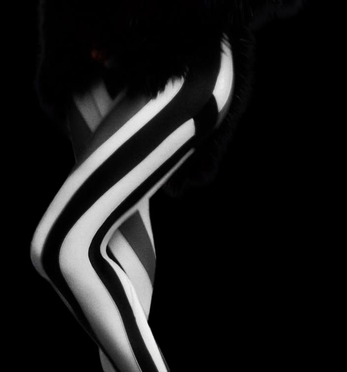 A pair of stylish women's black and white tights, showcasing a chic design suitable for various outfits.