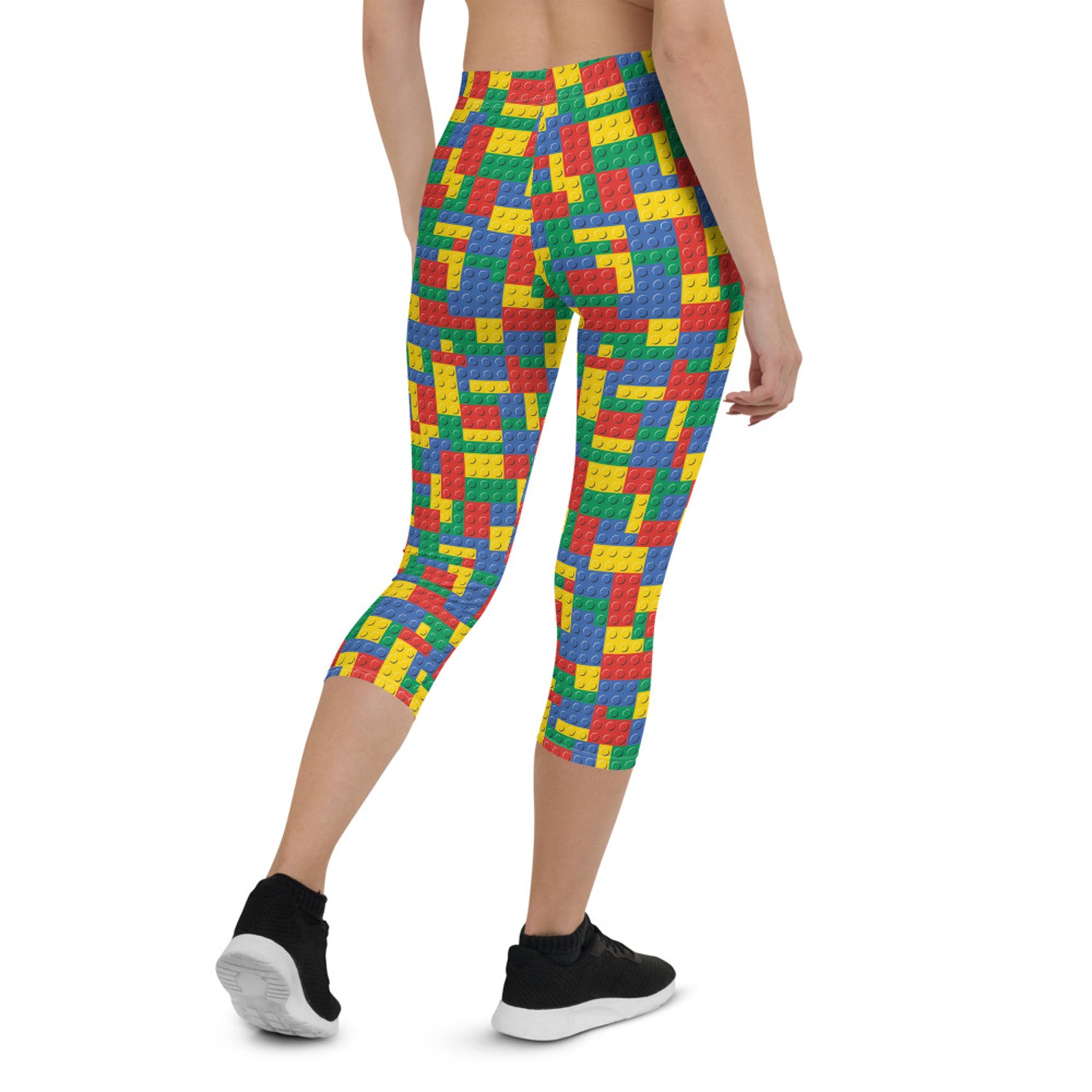 A pair of Women's Colorful Building Blocks Capri Leggings featuring vibrant, unique graphic designs, perfect for workouts and casual wear.